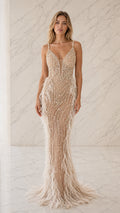 Front view of champagne beaded pearl and feather mermaid evening gown