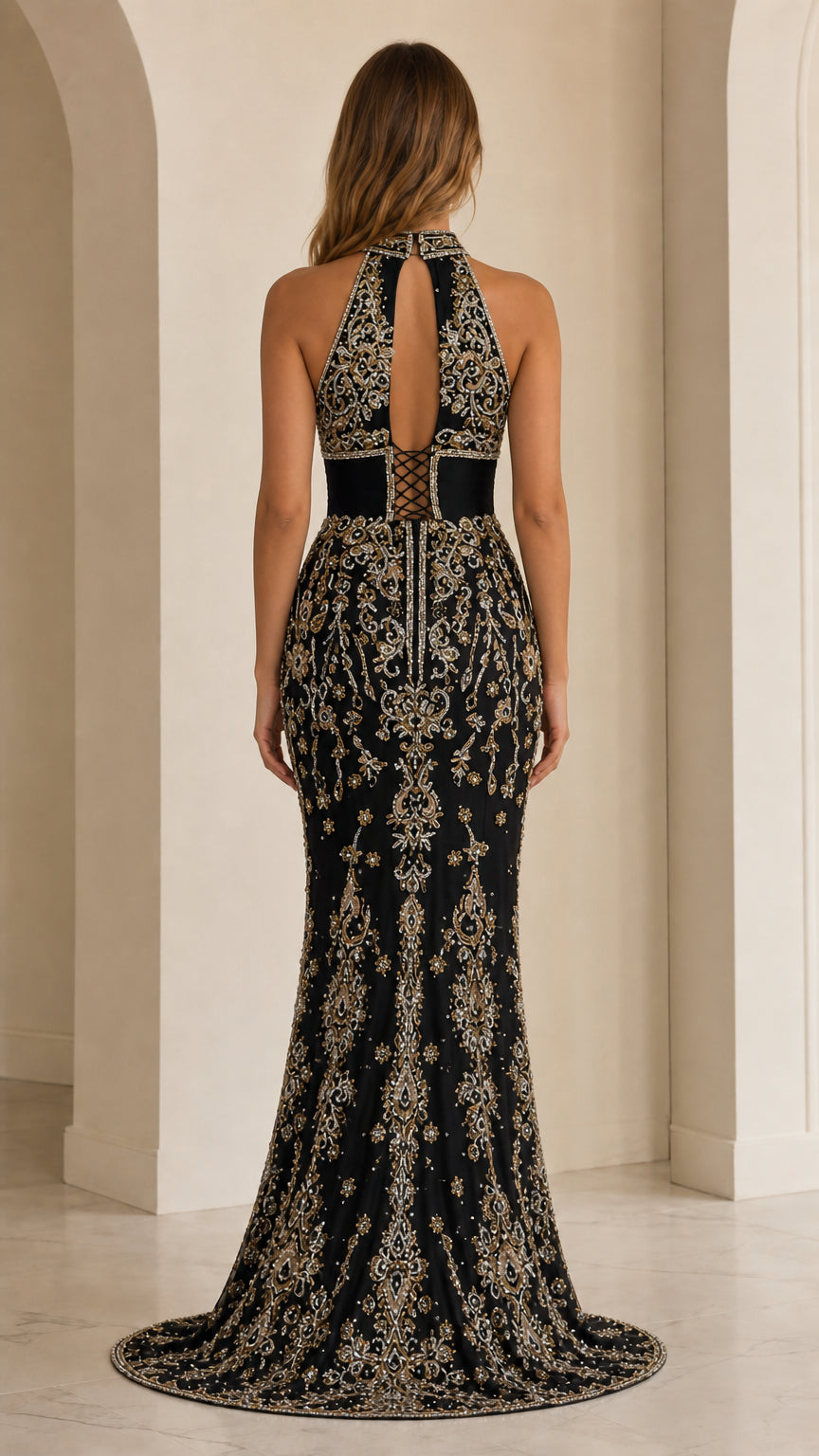 Back view of black halter gown displaying keyhole cutout and zip closure
