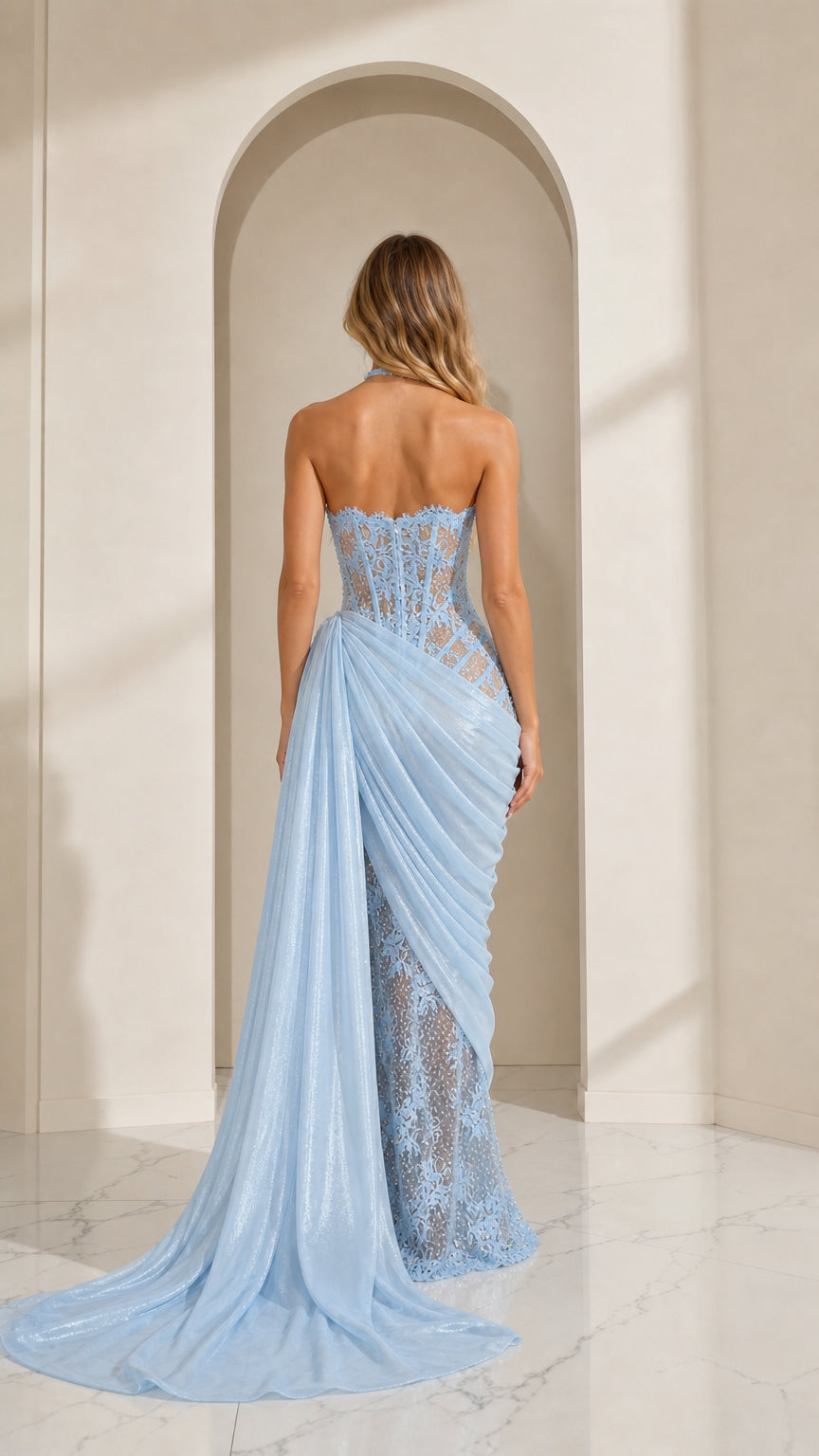 Sky blue evening gown back view showing flowing train and fitted silhouette