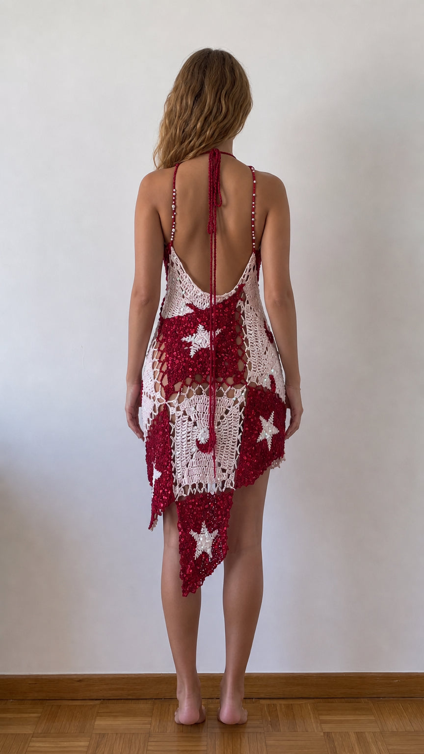 Back view of open back burgundy celestial crochet halter dress with tie closure