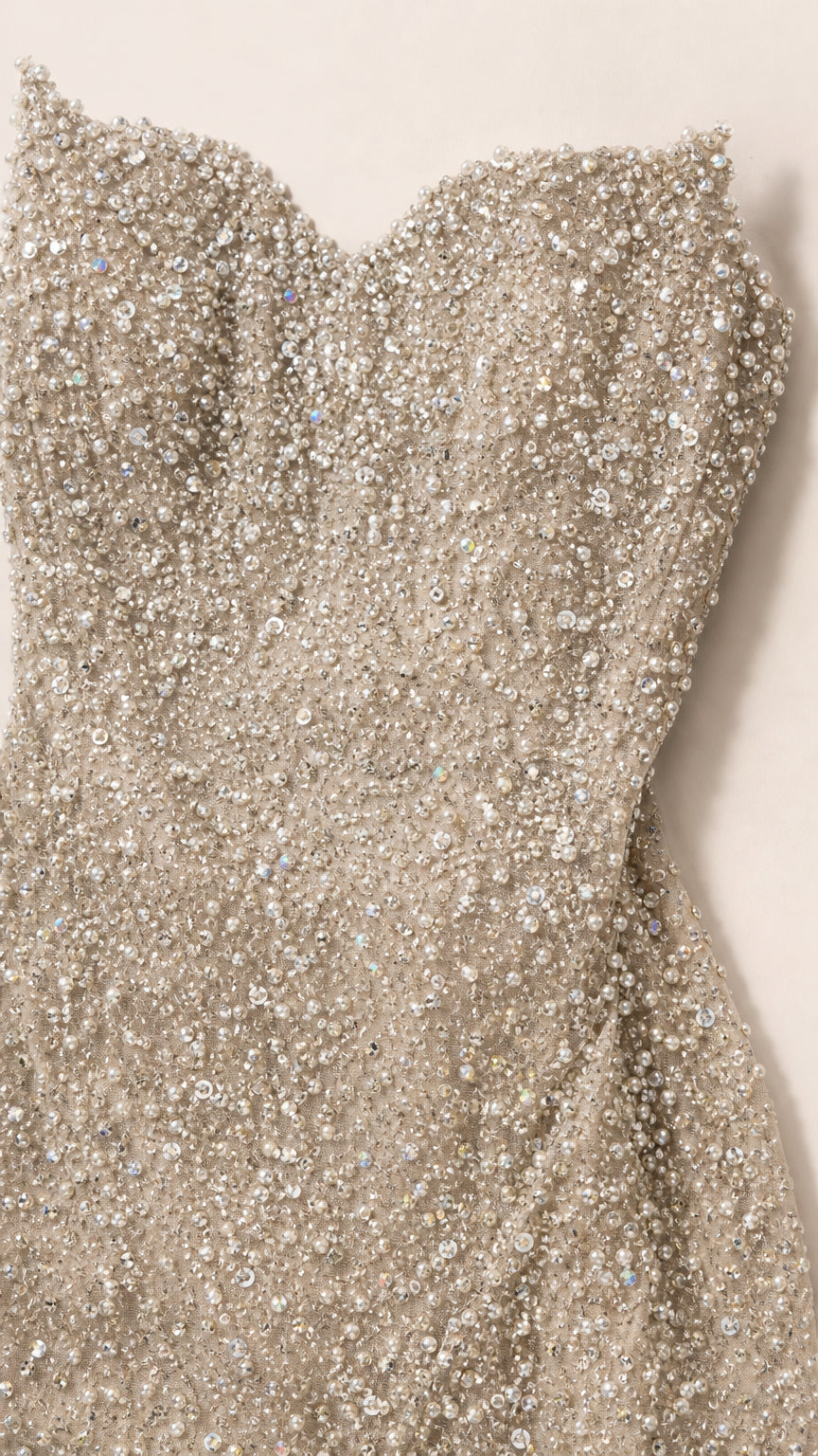 Close-up detail of textured sequin and bead embellishment on sweetheart bodice