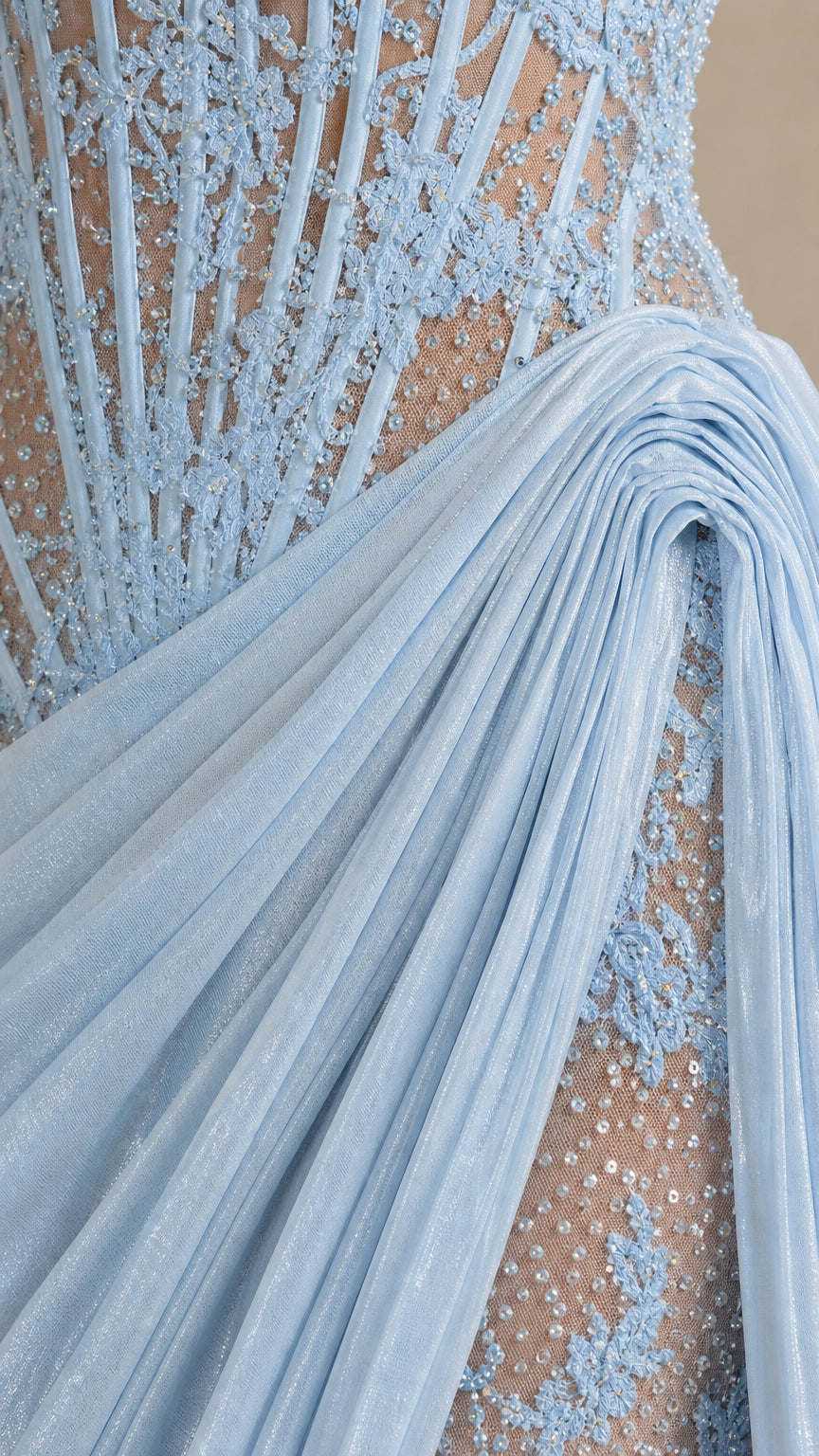 Close-up of sky blue sequin lace embroidery and pleated draped side accent