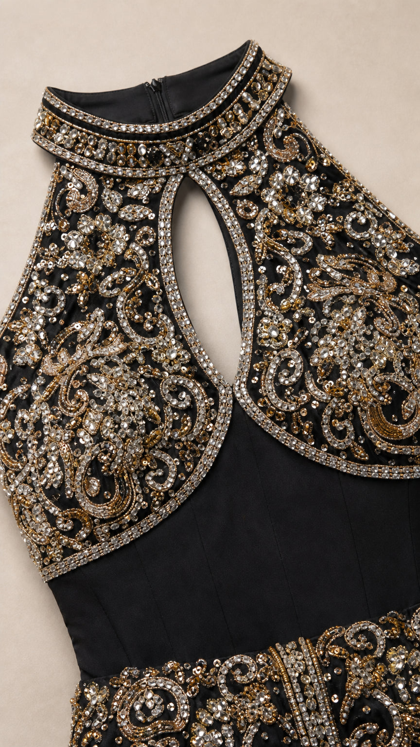 Close-up detail of high beaded collar and teardrop keyhole neckline