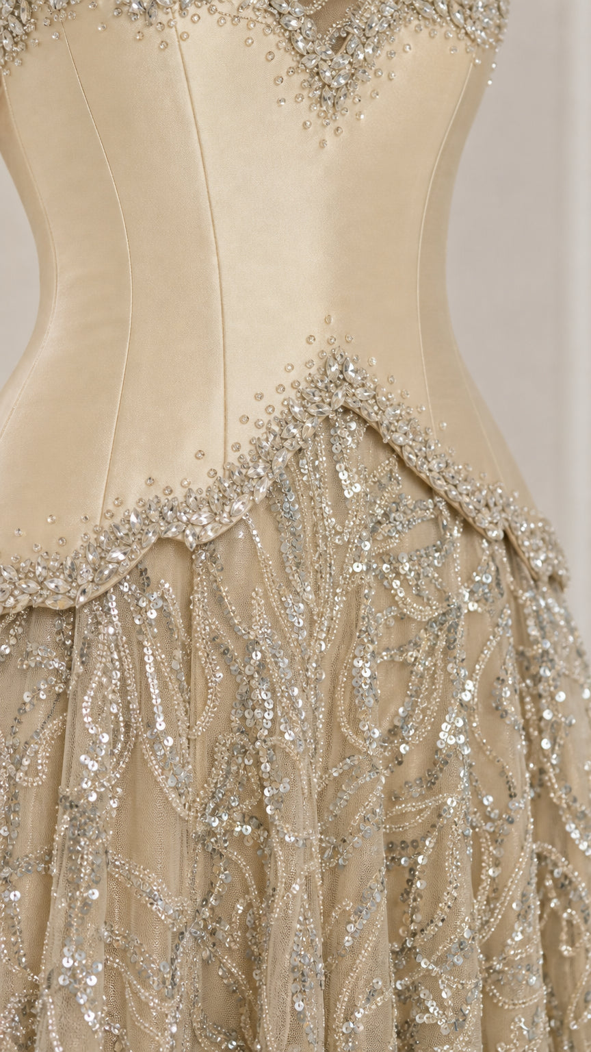 Close-up detail of beaded sweetheart neckline and basque waist on Champagne corset gown
