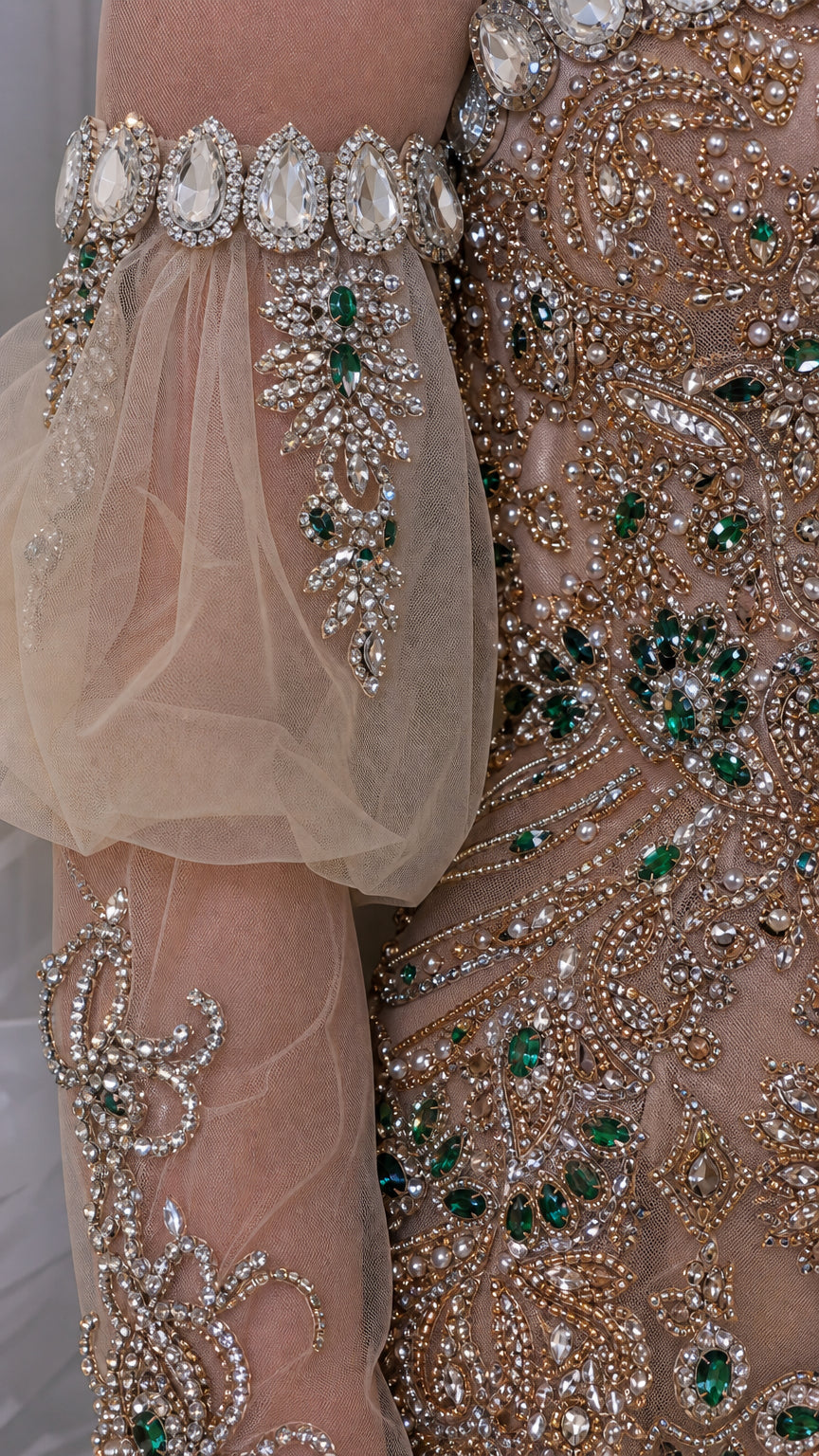 Close-up detail of sheer tulle puff sleeve with crystal and bead embellishments