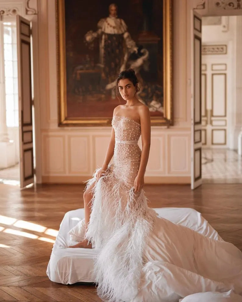 Sexy strapless corset wedding dress.Mermaid wedding dress with split slits with unique feathers.Beautiful pearl flower beaded wedding dress.