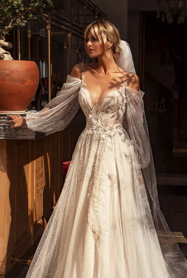 Boho wedding dress with sexy, liberal style and embellishments make the dress more attractive.