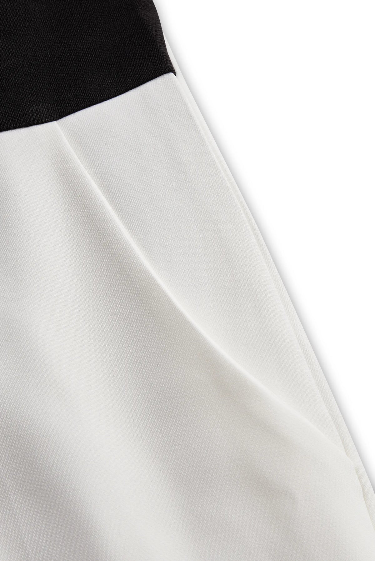 Sleek White Jumpsuit With Dual Button Detail And Black Lapel