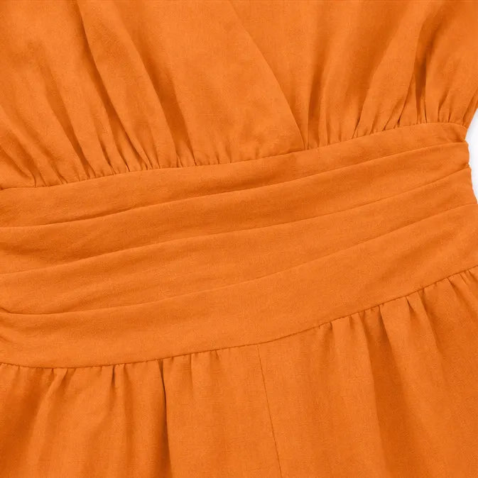 Soléra – Wide Leg V Neck Jumpsuit with Pleated Waist Sash
