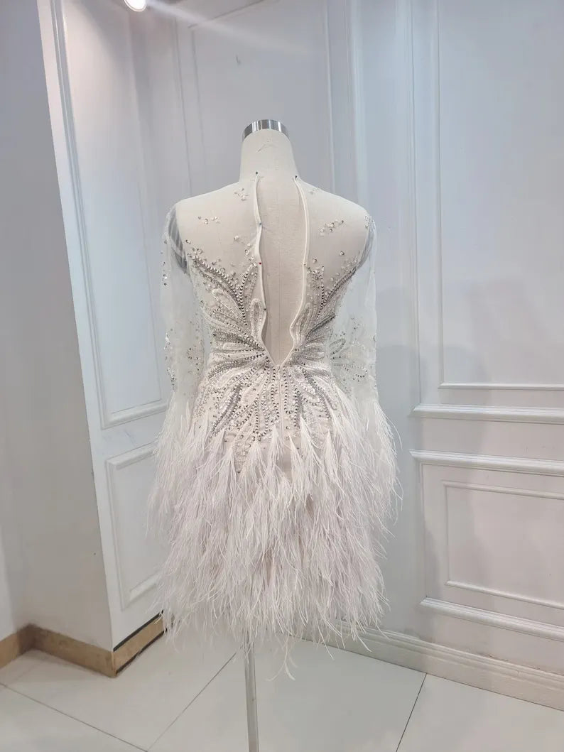 Custom Wedding Dress For Bride. Luxury short wedding dress with stones and feathers. Short wedding dress with elegant long sleeves.
