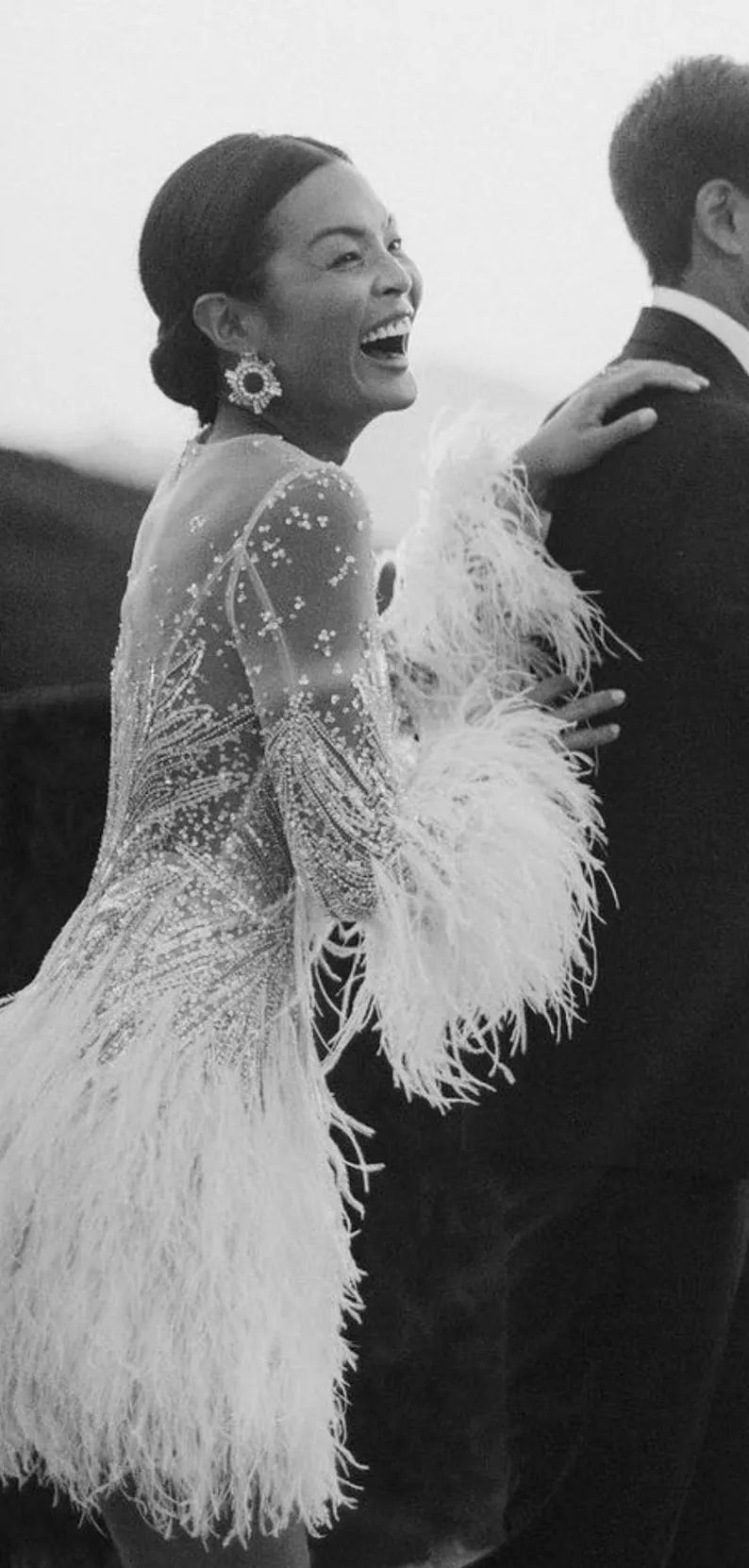 Custom Wedding Dress For Bride. Luxury short wedding dress with stones and feathers. Short wedding dress with elegant long sleeves.