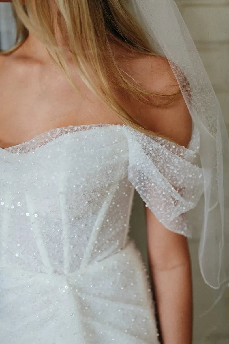 Elegant beaded off-the-shoulder short wedding dress. Sexy stylized pleated mini corset dress. Custom wedding dress, made to measure.