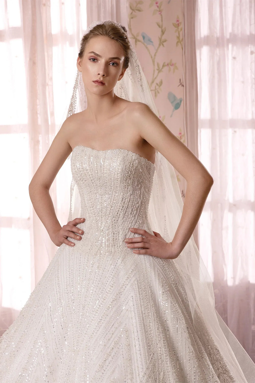 Strapless bridal gown featuring pearl and crystals