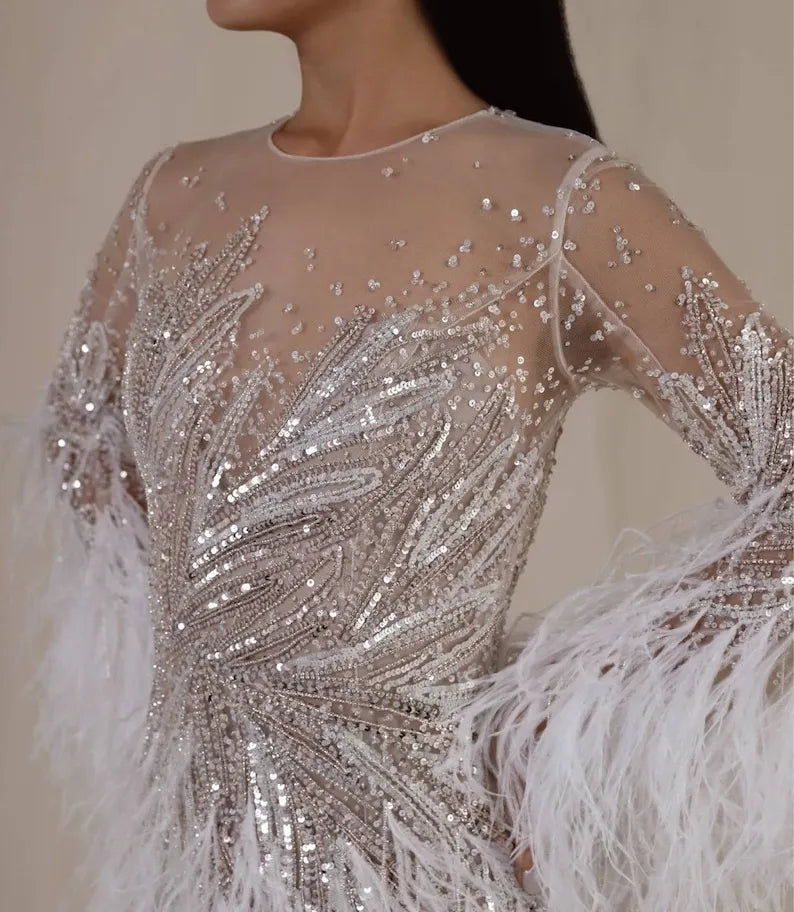 Custom Wedding Dress For Bride. Luxury short wedding dress with stones and feathers. Short wedding dress with elegant long sleeves.