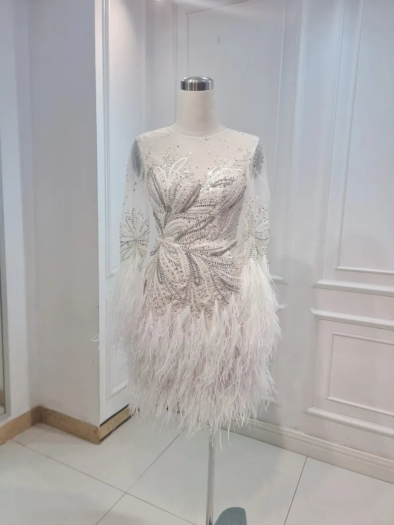 Custom Wedding Dress For Bride. Luxury short wedding dress with stones and feathers. Short wedding dress with elegant long sleeves.