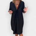 Elegant dress with V neckline and decorative hem