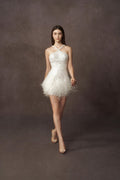 Custom short wedding dress for the bride. Mini wedding dress beaded and luxurious feathers.