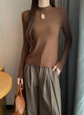 Coffee-colored turtleneck top with cutout details at the chest