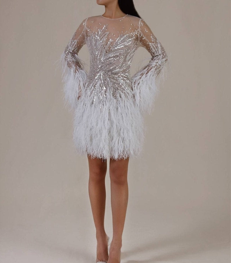 Custom Wedding Dress For Bride. Luxury short wedding dress with stones and feathers. Short wedding dress with elegant long sleeves.